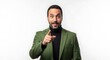 © MopoWe - Surprised businessman pointing finger at camera while wearing an olive green blazer and black turtleneck for a professional portrait on white background
