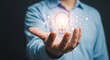 © Agung - Businessman Holding Digital Light Bulb Illustration in Hand Creative Innovation Concept