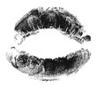 © Hasibul - Bold black lipstick kiss mark, isolated imprint on transparent background, intense female sensuality and passion.