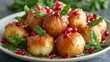 © Marry93 - Honey-drizzled loukoumades garnished with mint leaves and pomegranate seeds in soft spring daylight