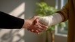 © Intach - Handshake between two people with one person having a bandaged arm