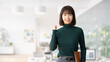 © Trickster* - ガッツポーズで喜ぶ日本人女性・ビジネスウーマンのビジネス成功イメージ, Japanese Businesswoman Celebrating Success with Fist Pump