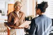 © Maria Vitkovska - Diverse businesswomen talking together, planning project in modern office