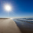 © Tetra Images - Morning sun on clear sky above Santa Monica Beach