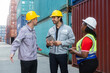 © Washburn - Logistics team briefing at shipping container yard
