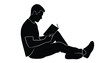© MdHumayn - Vector silhouette of a man sitting and reading a book