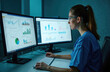 © Pete - Nurse in blue scrubs studies patient data on dual computer screens displaying graphs and charts. She uses keyboard to analyze medical information for accurate healthcare management.