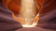 © DailyStock - Sunlight streaming into the narrow, winding sandstone walls of antelope canyon, featuring smooth, flowing orange and purple rock formations