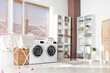 © Pixel-Shot - Interior of laundry room with washing machines, shelf units and stacked linen