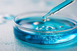 © Justin Eaton - Blue Liquid with Bubbles in Petri Dish Captures Microscopic View