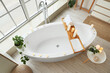 © Pixel-Shot - Interior of bathroom with bathtub, table and burning candles, top view