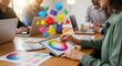© Bali Adventure Co - Design Team Collaboration: Graphic Designer Using Tablet with Color Wheel and 3D Shapes