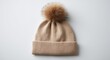 © Money - Cozy tan knit beanie with fluffy pom-pom, ribbed cuff, soft texture