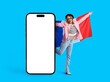 © Pixel-Shot - Happy woman with flag of France and big mobile phone with blank screen on blue background