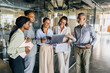 © Kostiantyn - Development team reviews demonstration while smiling and planning features