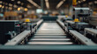 © Tichila - Empty conveyor production line in factory, representing logistics flow, manufacturing process, and industrial infrastructure.