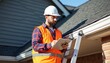 © Vadym - Man in hard hat and safety vest uses tablet on ladder checking house roof and gutter. Roofer inspects exterior building for repair, maintenance service. Tech work.