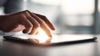 © Roman Luch - Close up of finger touching glowing digital tablet screen