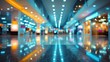 © Aldo - Blurred vibrant shopping mall interior with colorful lights reflecting on shiny floor