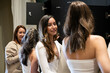 © Ladanifer - Women talking and smiling in a locker room, preparing for a wellness class