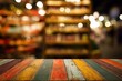 © Khawla - Vibrant Striped Wooden Table with Festive Bokeh Background. Image of wooden table in front and abstract blurred bright cinco de mayo background