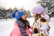 © Westend61 - Mother and daughter in warm clothes embracing outdoors in winter