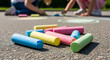 © val_webart - Children drawing with colorful chalks on pavement outdoors for international children's day