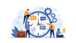 © Power Clipart - Productive office workers collaborate around a giant wall clock and gears to demonstrate effective time management and meeting project deadlines.