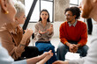 © Maria Vitkovska - Diverse group of people discussing ideas at a meeting
