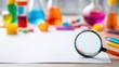 © Anat art - Explore Science With a Colorful Chemistry Set and Magnifying Glass Set Against a Clean Background for Curious Minds
