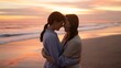 © Marc - Two women share an intimate moment on a beach at sunset.