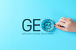 © Sandwish - GEO Generative Engine Optimization concept. Hand holding magnifying glass over AI search text, symbolizing content visibility, machine-driven discovery, digital strategy, search innovation, marketing,