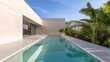 © Photo18@desing - Sleek modern architecture and a tranquil aqua pool define this minimalist outdoor oasis, harmoniously contrasting with lush tropical foliage under a bright blue sky. Modern, Luxury
