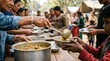 © Syauqiya - Volunteers serving food to people in need during crisis.