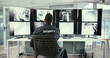 © peopleimages.com - Man, security guard and monitor in control room for safety, back or display for video analysis job. Person, surveillance officer and footage for review, computer or screen for crime prevention career