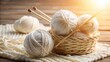 © ทองขาร พอใจ - A photo of a ball of white threads wrapped around wooden knitting needles on a light background Knitted objects peek out from behind the needles