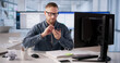© Andrey Popov - Young Man Digitizes Invoice Papers With OCR Technology