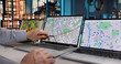 © Andrey Popov - Young GIS Specialist Analyzes Intricate Urban Map With Cutting-Edge Software