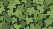 © Pkl - Seamless pattern of overlapping green ivy leaves on a dark background