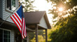 © Laku - Celebrating independence day a vibrant american flag waves proudly in front of a suburban home