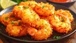 © supri - Golden brown crispy coconut shrimp piled high on a dark plate garnished with fresh chopped parsley and a lime wedge in soft natural lighting