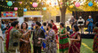 © rozy - Multicultural Friends Celebrating Together at an Outdoor Evening Garden Party