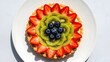 © MobiWall - Top View Delicious Fruit Tart with Fresh Strawberries, Kiwi Slices, and Blueberries on a White Plate, Perfect for Dessert Menu, Bakery Advertising, Food Blogging, and Gourmet Restaurant Promotions