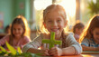 © Vadym - Girl crafts green palm cross in classroom. Children make religious symbols in school for Palm Sunday. Happy kid smiles, learns craft technique in morning sun.