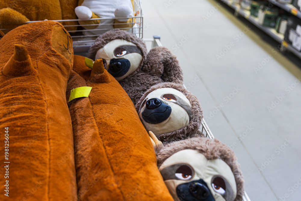 Fun Sloth Items A lineup of adorable stuffed sloth toys with playful, expressive faces ...
