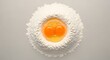 © sablengjago - Top-down shot of a flour nest with two egg yolks, ready for cooking preparation