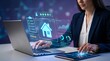 © Ayaz - A businesswoman using a laptop and tablet with virtual home interface