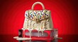 © Mewtwo - A stylish handbag sits on a table against a vibrant red background