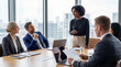 © Athena Studio - Diverse business professionals holding a dynamic meeting and presentation in a modern conference room with city views.