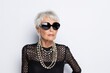© Rawpixel.com - Chic senior woman sunglasses necklace portrait.